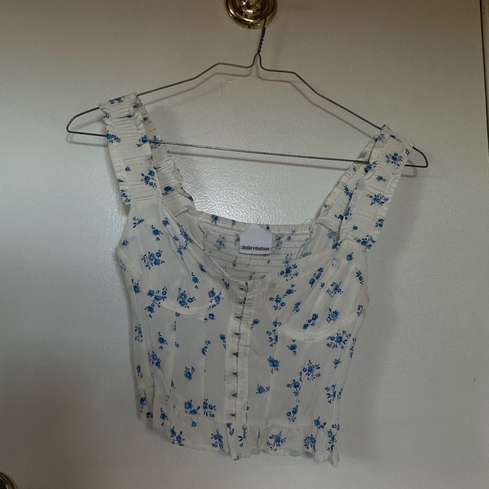 White with blue flower busier top